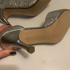 Women’s 3” heals,size 39 or8, mainly silver glitter but does pick up other